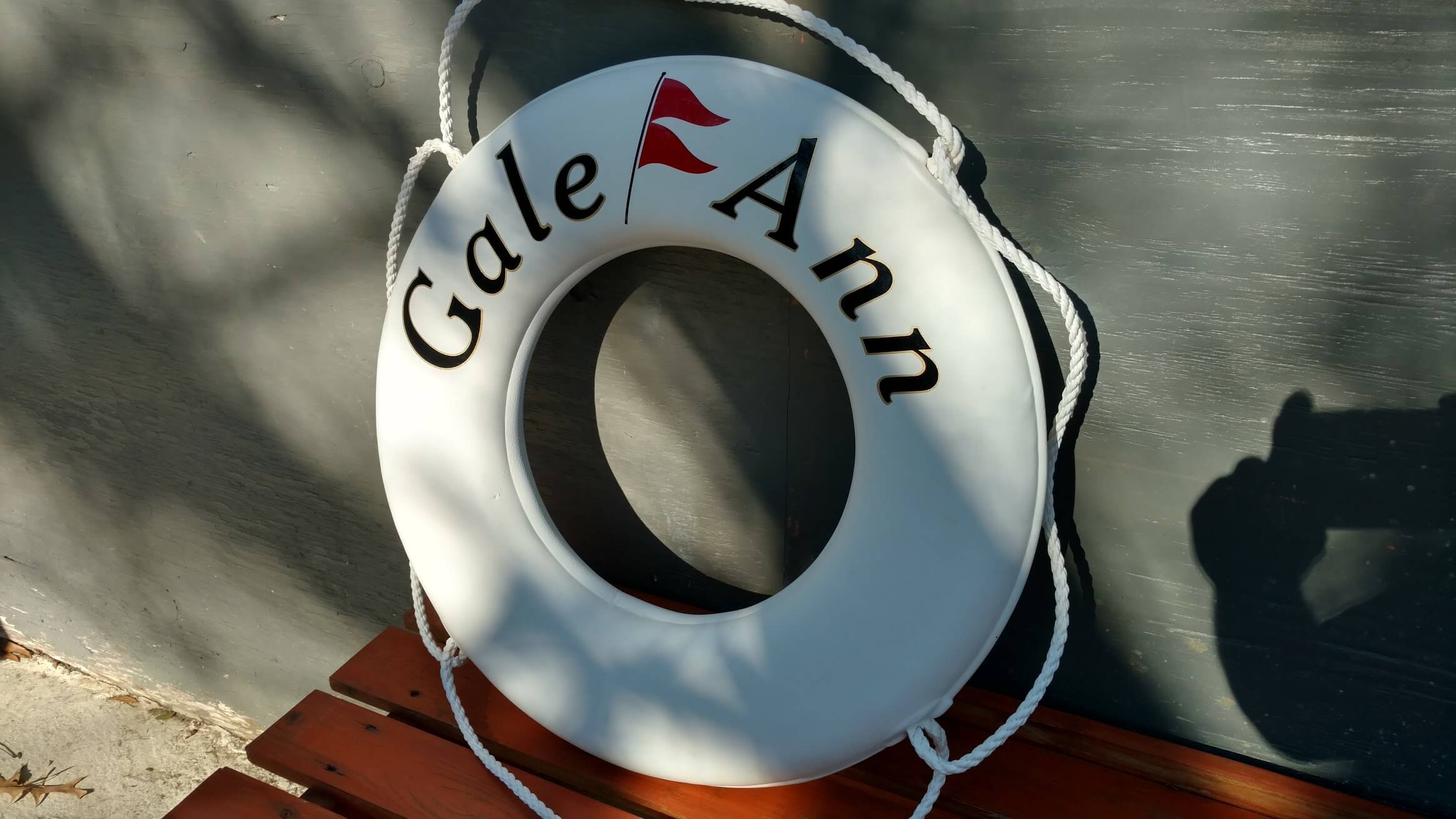 Personalized Ring Buoy with a Red Burgee, for Gale Ann.