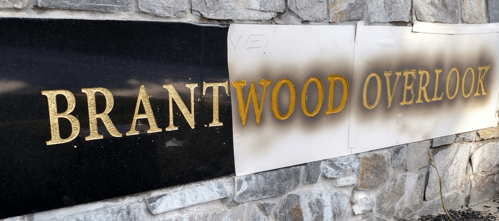 sandblasting stone letters and finishing with gold leaf