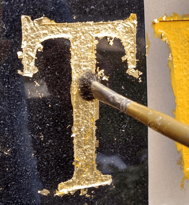 sandblasting stone letters, gold leaf