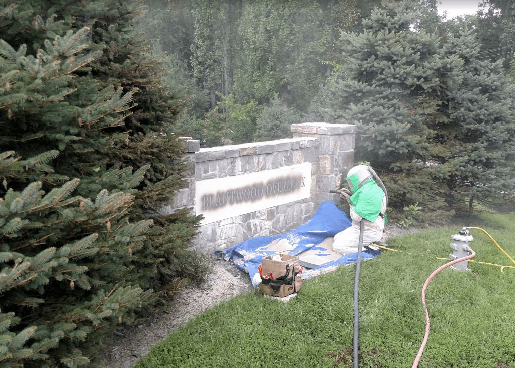 sandblasting stone letters into granite