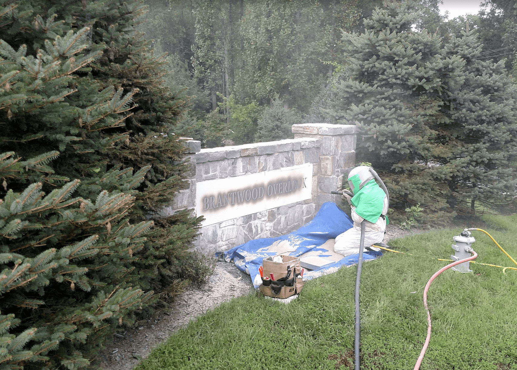 Sandblasting Stone Letters into Granite at Brantwood Overlook.