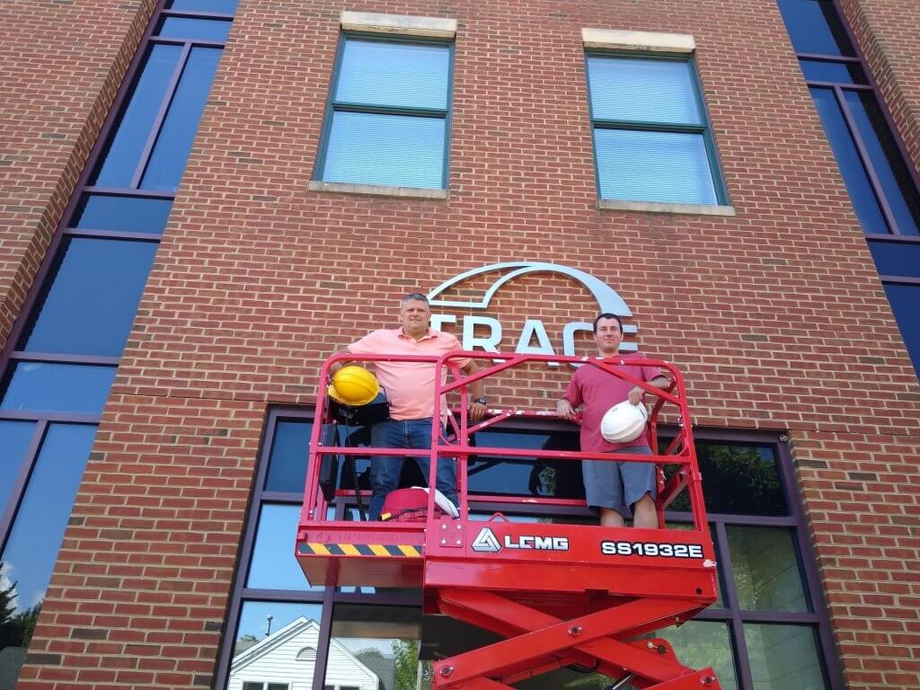 A small scissor lift was used to install the the new dimensional logo at Trace offices in Annapolis.