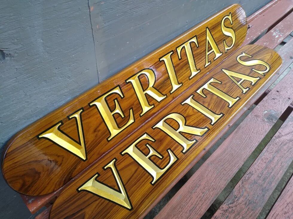 Carved boat name boards. Veritas with gold leaf!