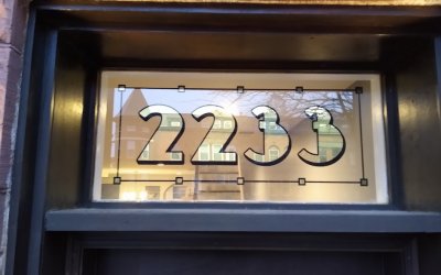Gold Door Numbers. Vintage transom numbers at 2233