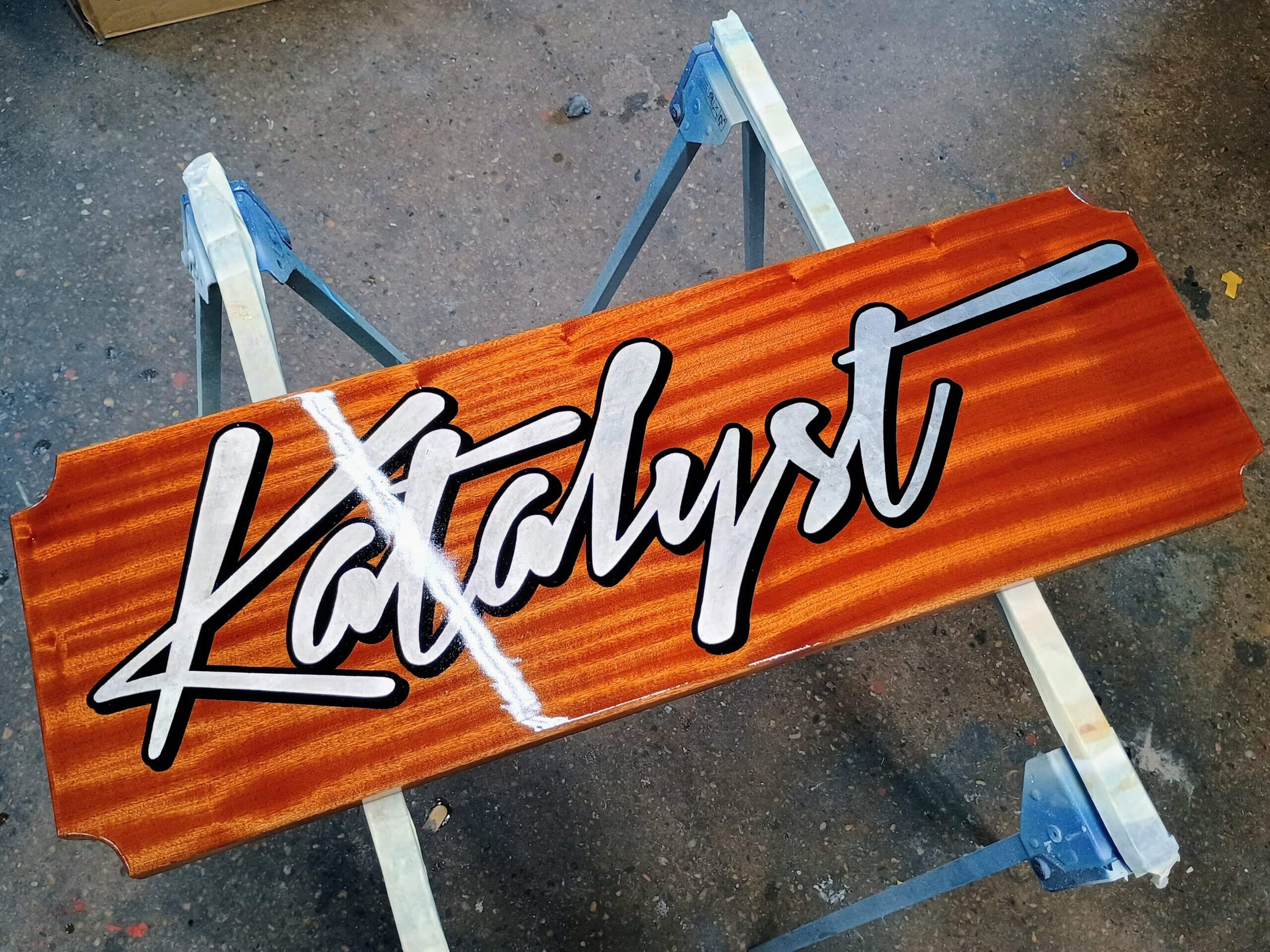 Katalyst palladium leaf quarterboard with script lettering on mahogany